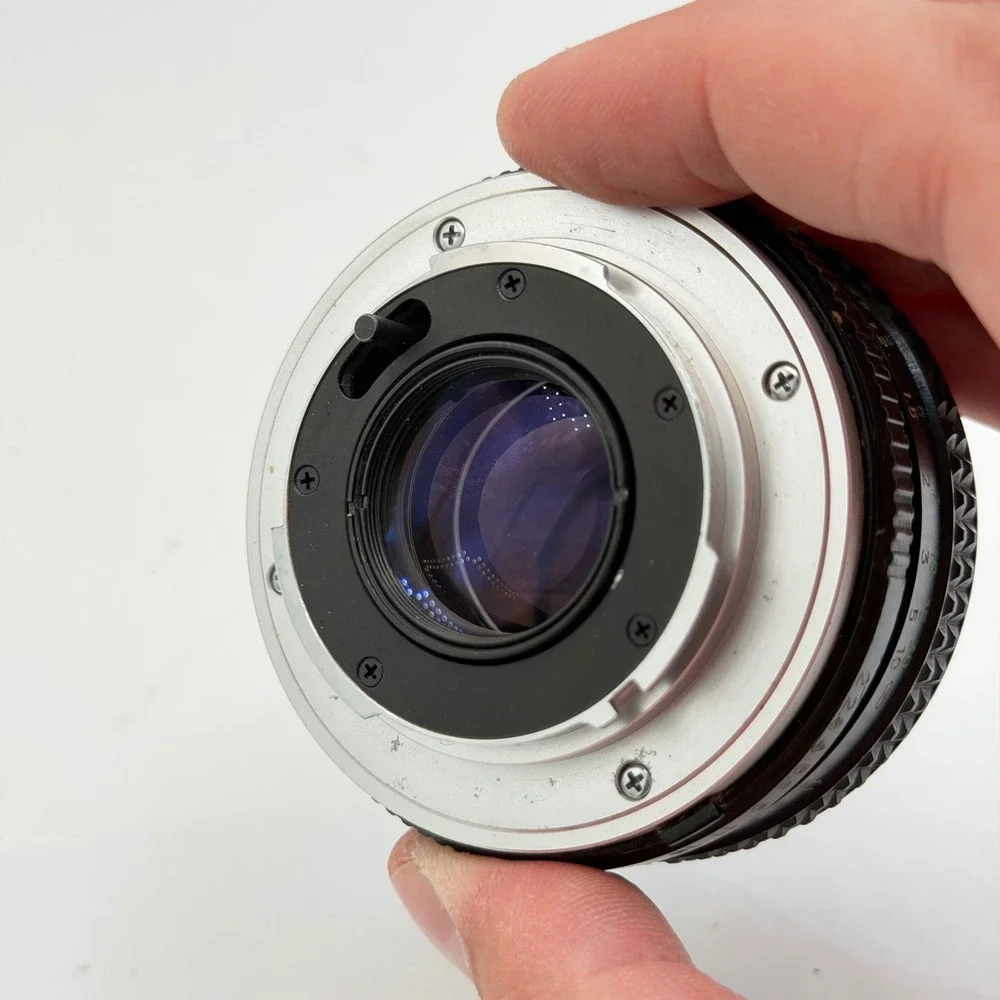 Minolta MC Rokkor-PF 50mm f/2 Lens with 55mm Skylight 1A Hood SR Mount 1126884